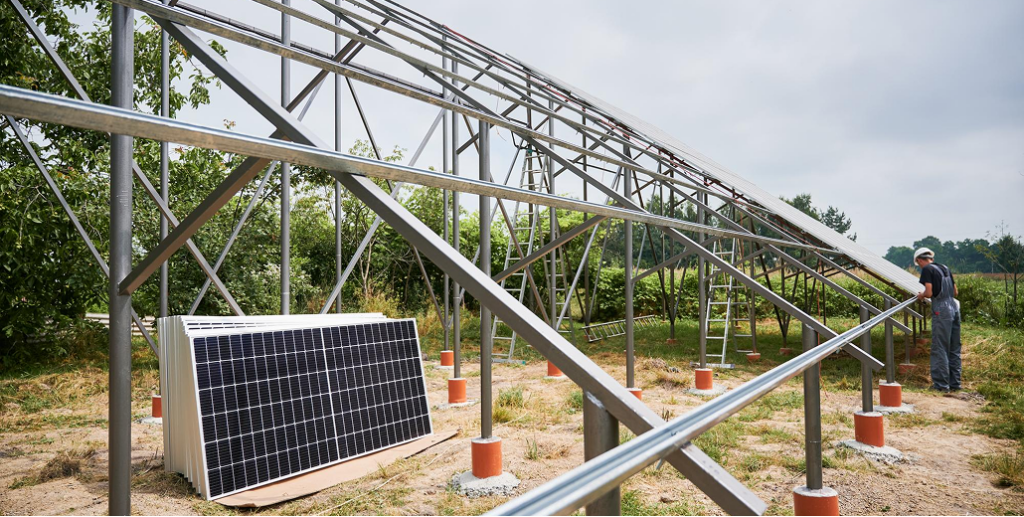 Installing a quality ground mount solar racking system, demonstrating features separating quality from cheap racking.