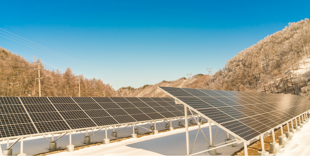 Fixed tilt ground mount solar panel system in a winter setting, demonstrating a good design.
