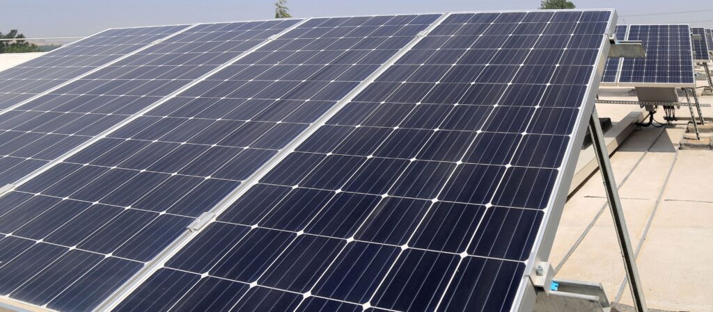 Tilted solar racking system on top of a flat roof.