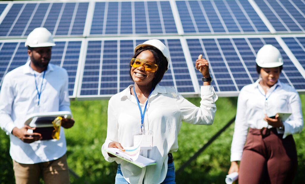 Three engineers installing a Solar Racking System.